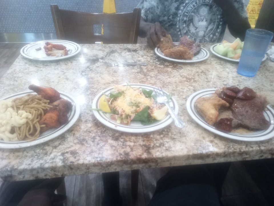 Buffet counters with trays of hot food